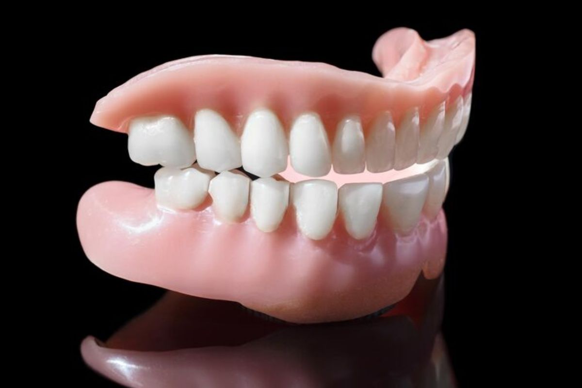 complete set of dentures showing upper and lower artificial teeth